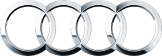 The Audi logo, featuring four interlocking silver rings, symbolizing the merger of four German automobile manufacturers into Auto Union, which later became Audi.