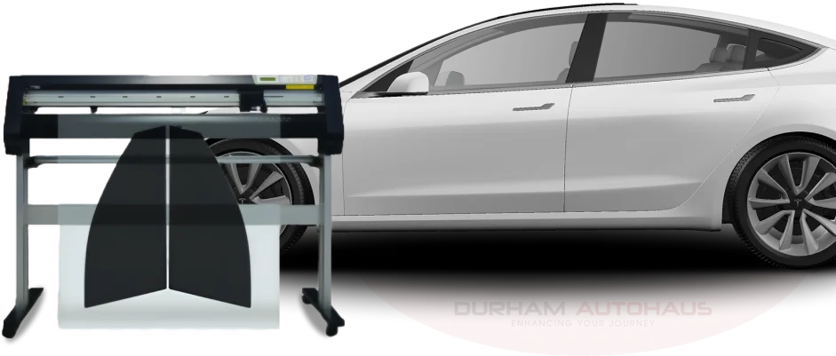 A vinyl plotter cutting a protective film template alongside a white Tesla Model 3, representing the process of creating and applying paint protection film (PPF) for vehicle preservation. The "Durham Autohaus" branding is subtly visible beneath the car.
